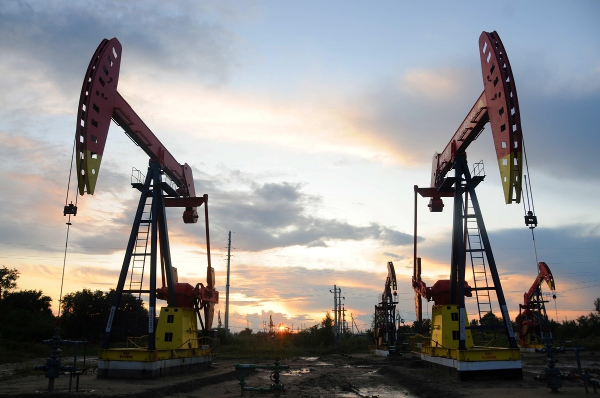 pumpjacks are seen during sunset at the daqing oil field in heilongjiang province china anh reuters 3859.jpeg