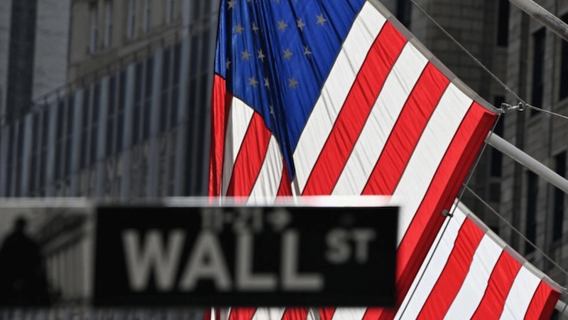 A Wall Street sign at the New York Stock Exchange NYSE on February 17 2021 in New York City Angela WeissAFP